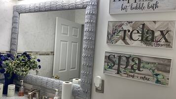 Combined shower/tub, hair dryer, towels, soap