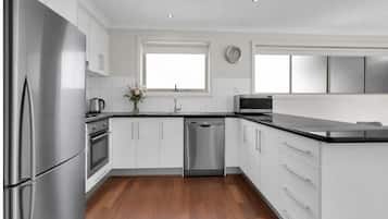 Coffee/tea maker, fridge, microwave, oven