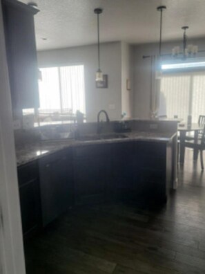 Microwave, dishwasher, coffee/tea maker, cookware/dishes/utensils