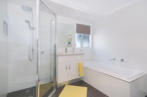 Bathtub, hair dryer, towels
