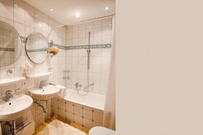 Bathtub, hair dryer, towels