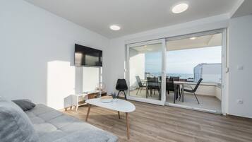 Deluxe Apartment, 2 Bedrooms, Balcony, Pool View | Living area | Smart TV