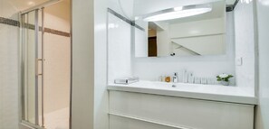 Bathtub, hair dryer, towels, soap