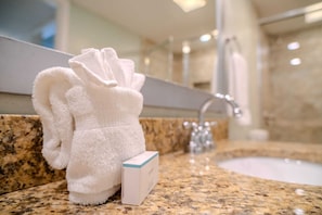 Shower, hair dryer, towels, shampoo
