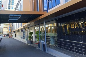 A modern hotel facade with a prominent sign reading "TIBATA HOTEL". - Batam 1 Hotel (Batam)