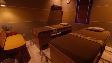 Relax in a well-appointed room with two single beds, a wooden bench, and a small desk for work or relaxation.