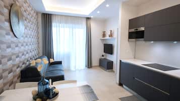 Appartement, 1 chambre, balcon | Coin séjour | Télévision à écran plat