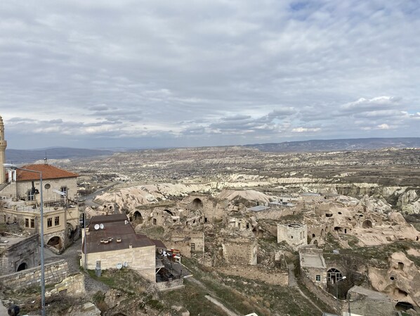 A historic town with ancient architecture and a panoramic view of the surrounding landscape. - Alice in Cappadocia (Nevsehir)