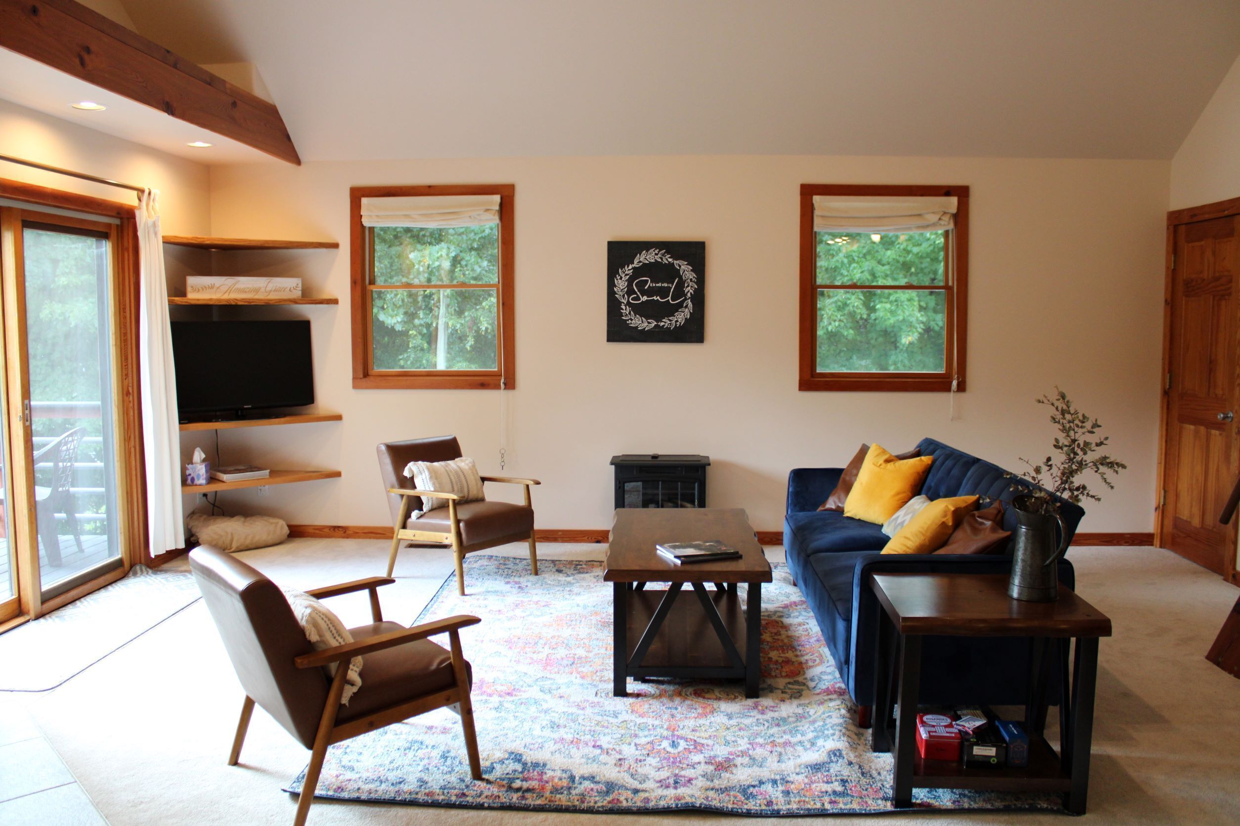 Living Area is spacious and well lit.  Furniture is newer and in great condition