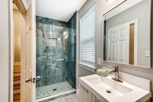Shower, hair dryer, towels, soap