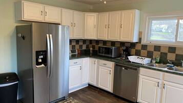 Oven, coffee/tea maker, toaster, cookware/dishes/utensils