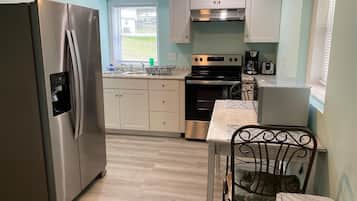 Oven, coffee/tea maker, toaster, cookware/dishes/utensils