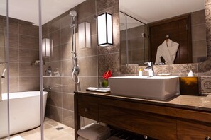 Executive Suite | Bathroom | Free toiletries, hair dryer, bathrobes, slippers - The Elite Narasapura, a member of Radisson Individuals (Kolar)