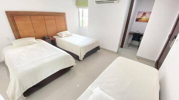 Desk, laptop workspace, blackout drapes, iron/ironing board