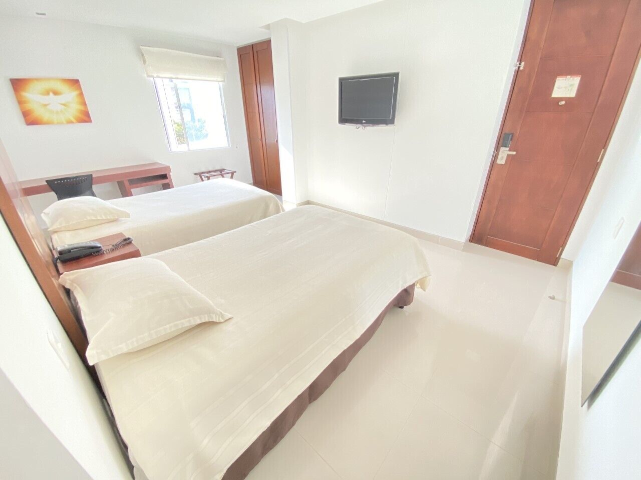 twin room | desk, laptop workspace, blackout curtains, iron/ironing board