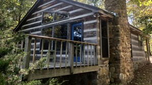 A cabin with a wooden deck, stone walls, and large windows. - Secluded yet within minutes of your favorite outdoor activities!! (Marshall)