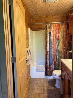Combined shower/bathtub, hair dryer, towels, soap