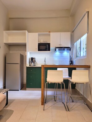Apartment, 1 Bedroom | Private kitchen | Full-sized fridge, oven, coffee/tea maker, cookware/dishes/utensils