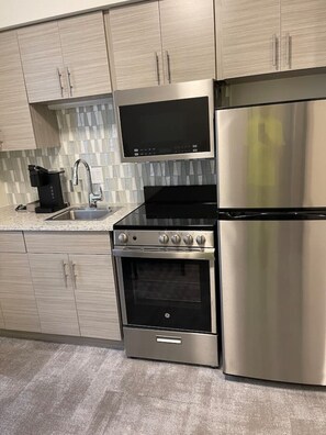 Coffee/tea maker, fridge, microwave, oven - Downtown Historic Warehouse District Lofts 205 (Cleveland)