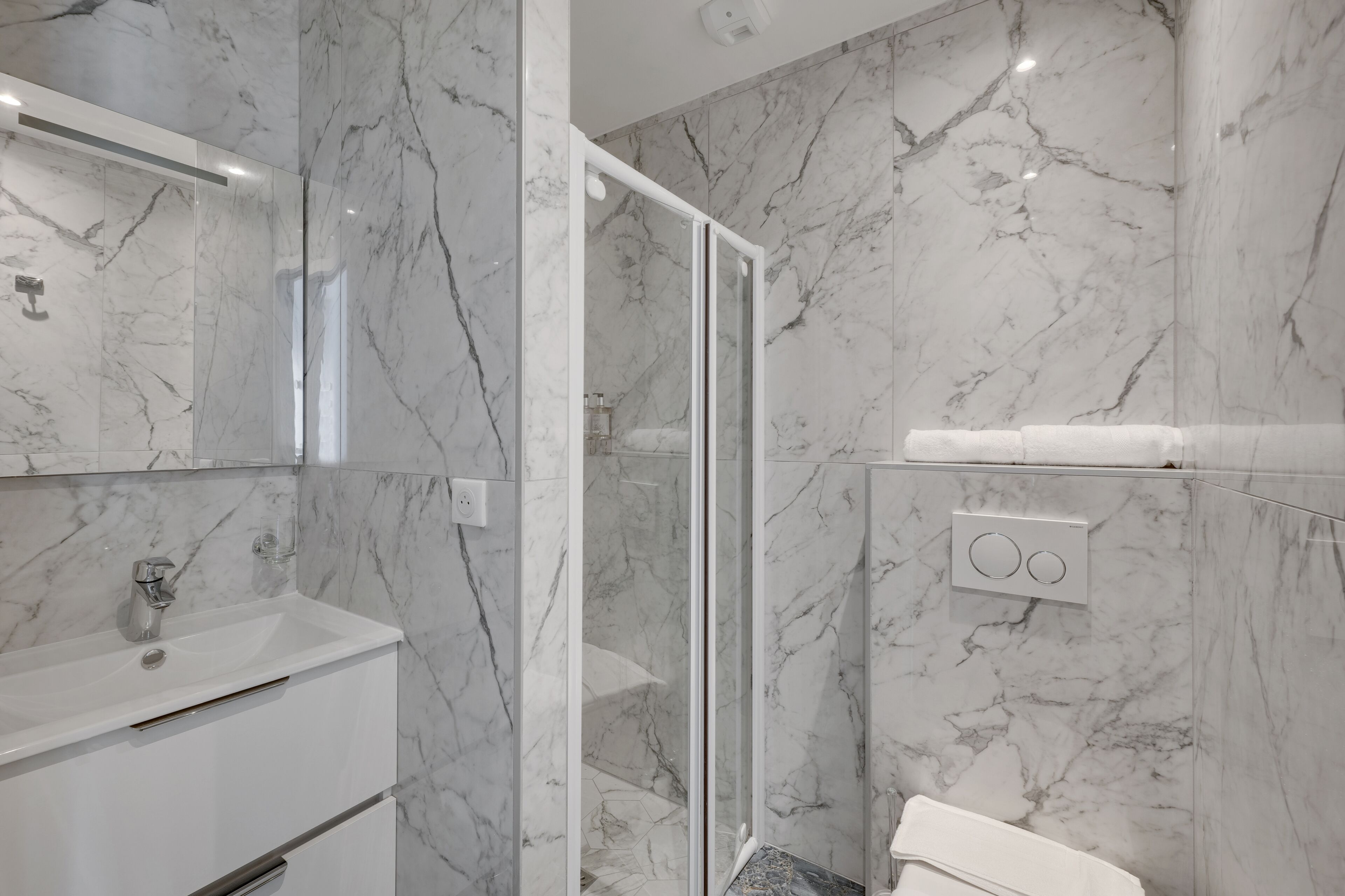 Shower, rainfall showerhead, eco-friendly toiletries, hair dryer