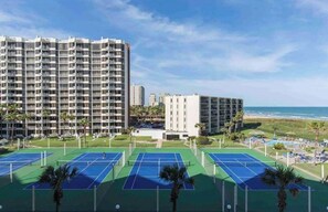 Enjoy tennis on our outdoor courts surrounded by lush greenery and ocean views.