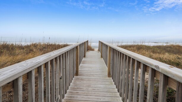 A wooden boardwalk leading to a beach with a clear sky. - Ocean Front w/Pool! Hot Tub, Quiet Neighborhood, D0130 (Duck)