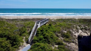 A wooden boardwalk leading to a beach with a view of the ocean. - Ocean Front w/Pool! Hot Tub, Quiet Neighborhood, D0130 (Duck)