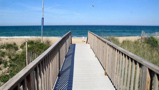 A wooden boardwalk leading to a beach with a clear view of the ocean. - Modern, Community Pool, Quick walk to beach! Hot tub! NH4912 (Nags Head)