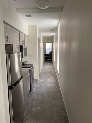 Coffee/tea maker, fridge, microwave, oven - Downtown Historic Warehouse District Lofts 301 (Cleveland)