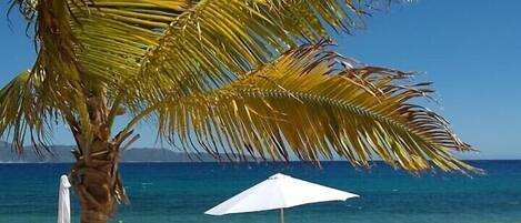 On the beach, sun loungers, beach towels