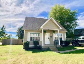 Stylish single-story home with a gabled roof and inviting front porch.