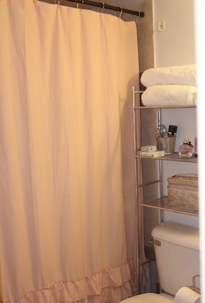 Combined shower/bathtub, towels, soap