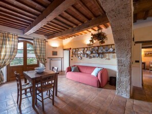 Cozy dining area with a wooden table and comfortable seating.