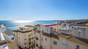A coastal residential area with multi-story buildings, balconies, and a view of the sea. - Holiday home "Balcon de Benalmadena Ocean Views" with Pool, Terrace & Wi-Fi [only guests over 25] (Benalmádena)