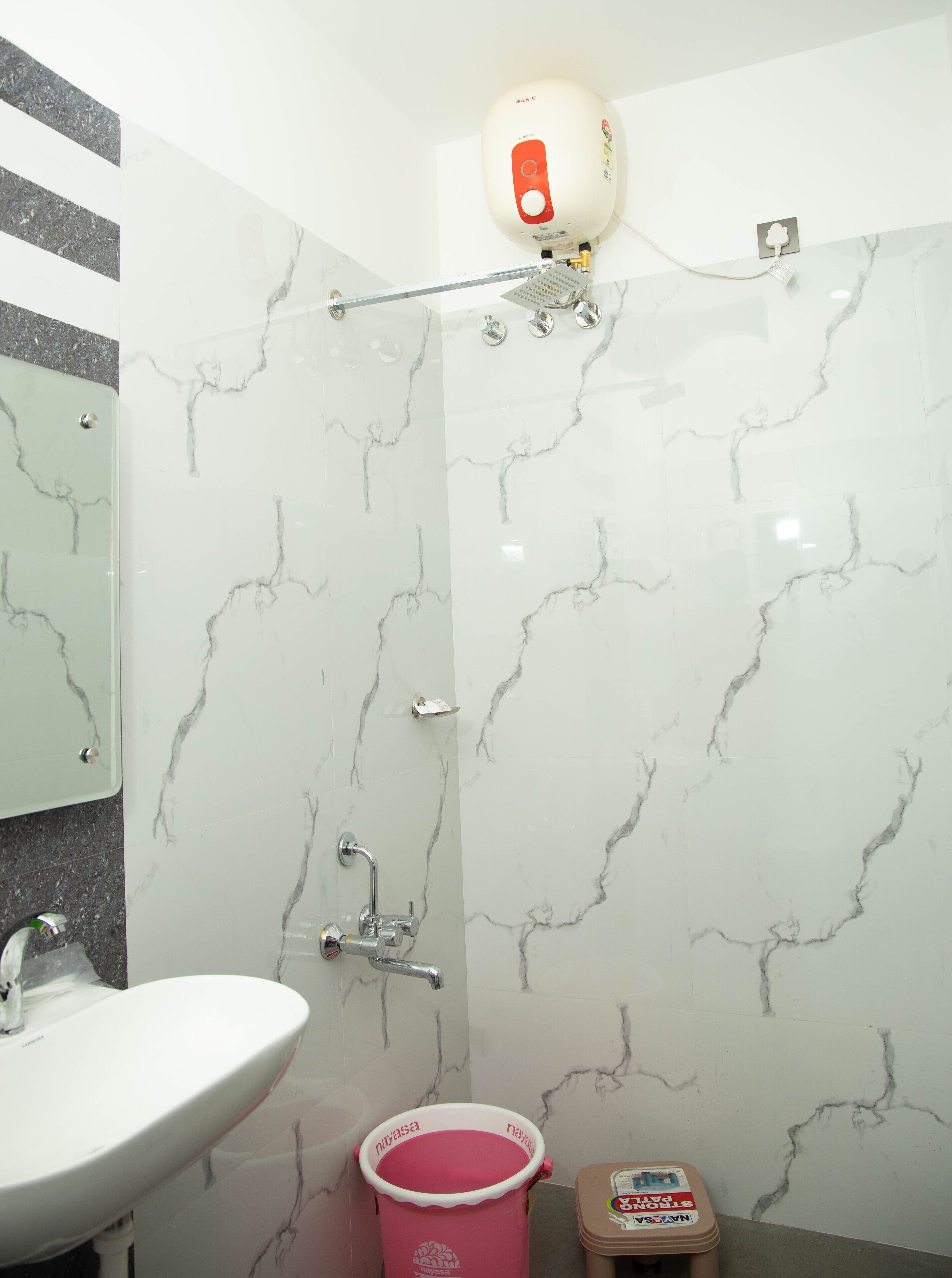 Deluxe Double Room (AC) | Bathroom | Shower, free toiletries, towels, soap