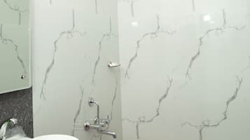 Deluxe Double Room (AC) | Bathroom | Shower, free toiletries, towels, soap