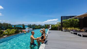 Outdoor pool, open 7:00 AM to 7:00 PM, pool umbrellas, pool loungers
