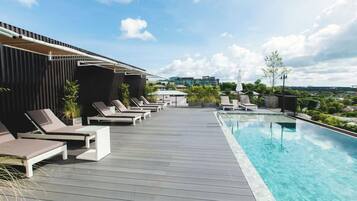 Outdoor pool, open 7:00 AM to 8:00 PM, free pool cabanas, pool umbrellas