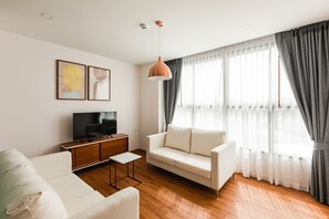 Deluxe Room, 1 Bedroom | Living room | 40-inch Smart TV with digital channels, TV - The Proud Rawai Resort (Rawai)