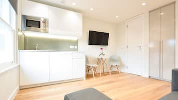 One Bedroom Apartment | Living area | 32-inch TV with satellite channels