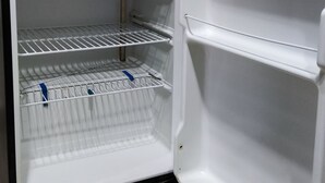 An open refrigerator with multiple shelves and a freezer compartment. - Private & Secure 1BHK Flat - Central location Ph7 (Rawalpindi)