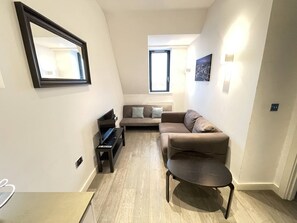 Apartment | Living room | 30-inch TV with cable channels