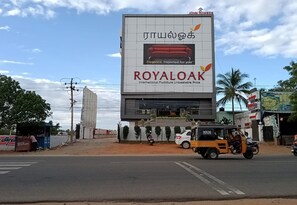 A building with a large billboard advertising furniture. - John Towers (Surat)
