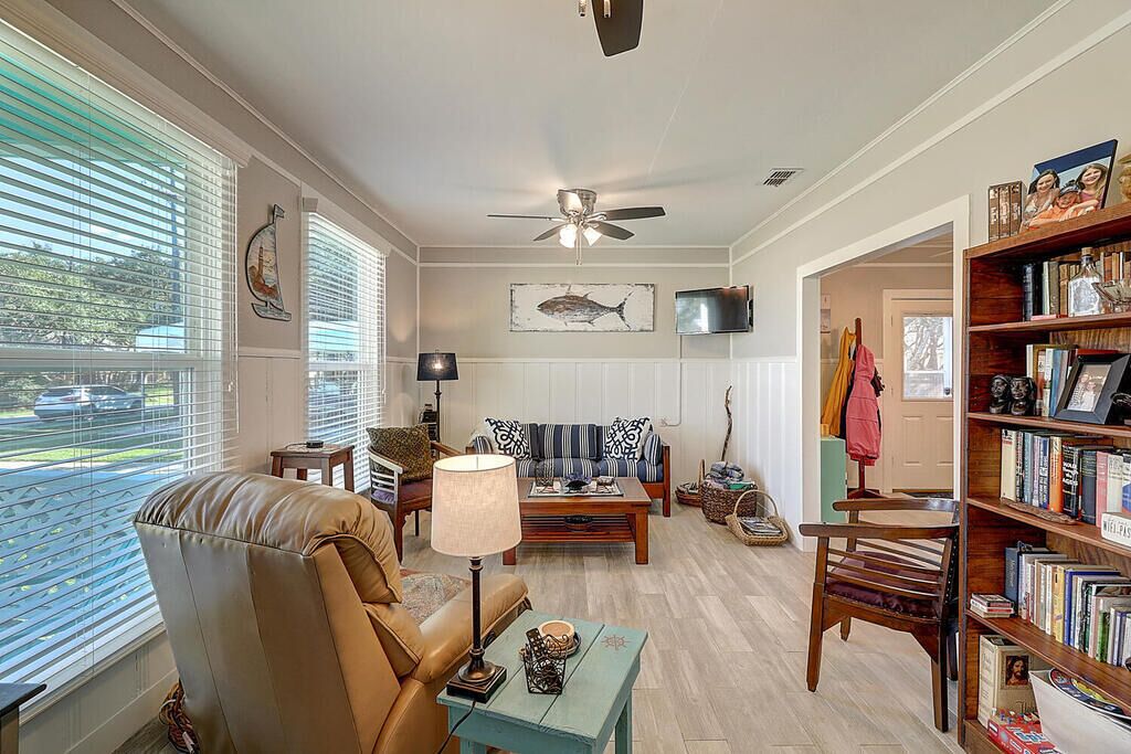 Living area with large windows. Relax with a good book and cup of coffee. 