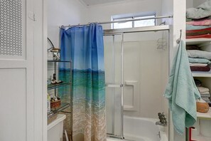 Bathtub, hair dryer, towels, soap