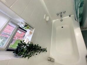 Combined shower/tub, hair dryer, towels, soap