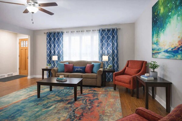 A living room with a sofa, armchair, coffee table, and a ceiling fan. - *The Comfy King Ranch*King Bed Suite*Fast Wi-Fi (Worth)