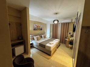 A hotel room with a bed, bedside table, lamp, curtains, and a ceiling light fixture. - Hotel Driloni (Ksamil)