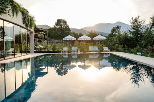 2 outdoor pools, open 8:00 AM to 6:00 PM, pool umbrellas, pool loungers