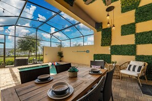 Outdoor dining - Sleeps 17 | Pool + Game Room | Steps to Solara Resort (Kissimmee)